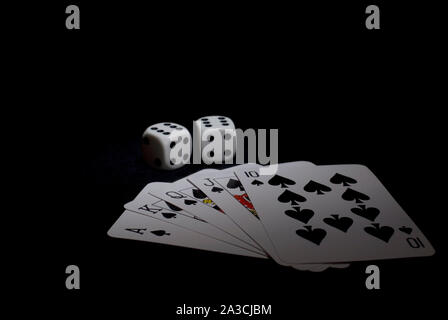 Royal Flush of Spade with Double Six Dices on Black Stock Photo