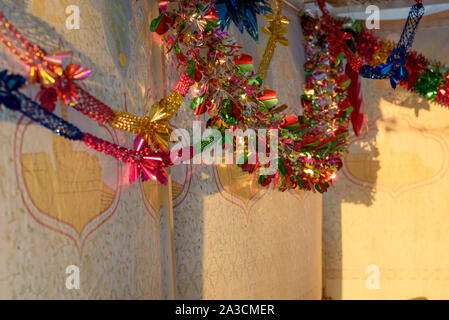 Colorful Sukkah decoration shiny garland at sunset light. Stock Photo