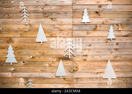Christmas tree on wooden wall background. Wooden tree on wooden background. Symbol of Christmas. Interior background. copy space. Original decoration for Christmas time Stock Photo