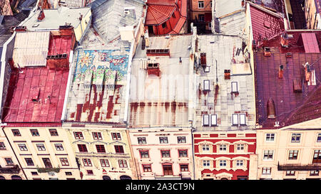 Lviv, Ukraine - May 20, 2019: View of the old Lviv. Bright color roofs of houses in historical city center. Banner crop 16 in 9. Stock Photo