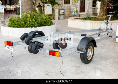 PETROVAC, MONTENEGRO - SEPTEMBER 14, 2019: Empty trolley cart on wheels for boat Stock Photo