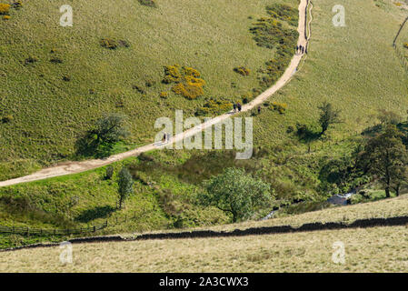 Walkers on the Pennine Way near Jacobs Ladder, Vale of Edale in the Peak District, Derbyshire, England. Stock Photo