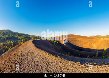 Gravel footpath on Summit of Lassen Volcanic National Park, California, USA around sunset. Captured with Fisheye lens. Stock Photo