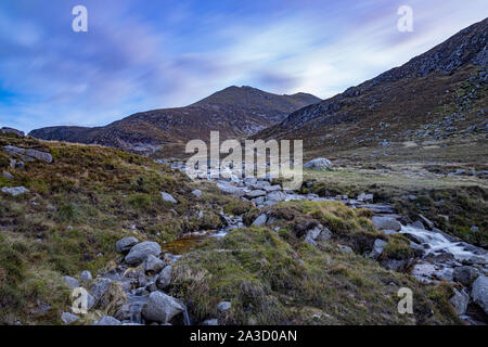 Long exposure Slieve Bearnagh, Mourne Mountains, Newcastle, County Down, Northern Ireland at Trassey track and stream Stock Photo