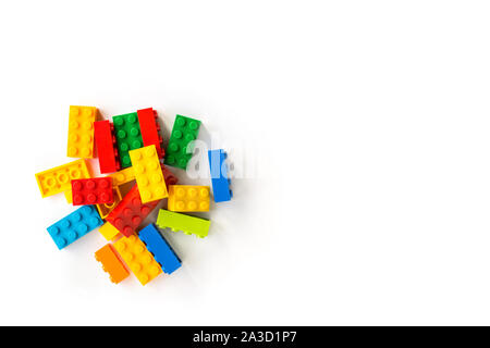 Bunch of Colorful Plastick constructor cubes on white background. Popular toys. Copyspace Stock Photo