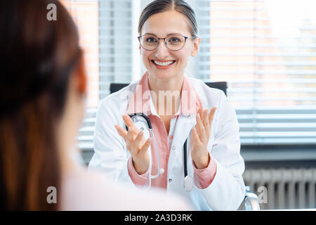 Young female doctor seeing woman patient Stock Photo