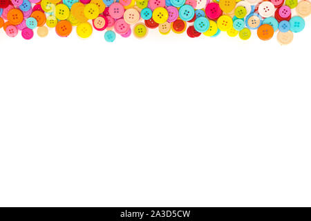 Colorful Sewing buttons on white background. Top view. Free space. Border Stock Photo