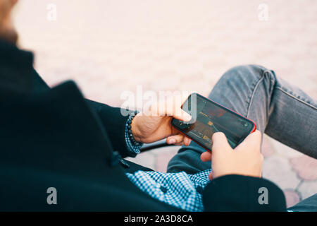 Bishkek, Kyrgyzstan - October 10, 2019: Man playing online game in call of duty mobile on iphone 11 Stock Photo