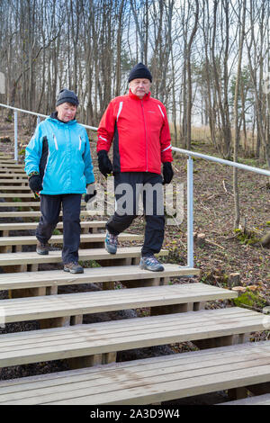 Elderly couple doing daily excercise by walking stairs Stock Photo