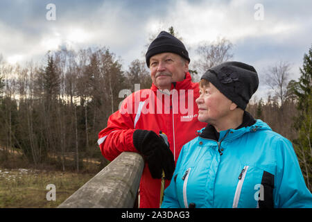 Elderly couple doing daily excercise by walking outdoors Stock Photo