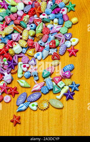 Colorful plastic craft beads pieces assortment variety Stock Photo