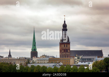 Charming streets and houses of Old Riga. In the panorama of the city reigns Dome Cathedral (Dom zu Riga) Stock Photo