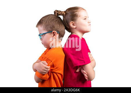 Sister and brother were offended at each other. Isolated on a white background. Stock Photo