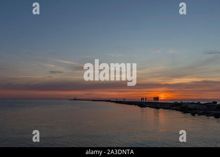 Lighthouse at the entrance to the port of Riga in the evening, Stock Photo