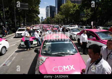 Thousands of taxis are seen parked on the roads around the statue of the Angel of Independence in Mexico City.  Photo credit: Lexie Harrison-Cripps Stock Photo