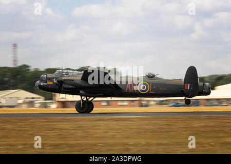 Lancaster Histoirc bomber landing at Fairford Air Force base Stock Photo