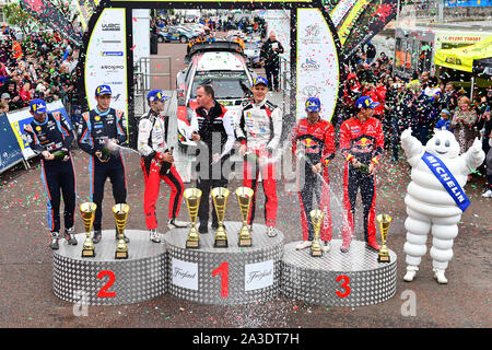 6th October 2019, Wales ; Wales Rally GB 2019 Podium: 2019 winners Ott TANAK & Co Driver Martin JERVEOJA competing in the Toyota Yaris WRC for Toyota Gazoo Racing WRT, with Thierry NEUVILLE & Co Driver Nicolas GILSOUL competing in the HYUNDAI i20 Coupe WRC for Hyundai Shell Mobis World Rally Team in 2nd spot and Sebastien OGIER & Co Driver Julien INGRASSIA competing in the Citroen C3 WRC for Citroen Total WRT finishing in 3rd spot. Credit: Gareth Dalley/News Images Stock Photo