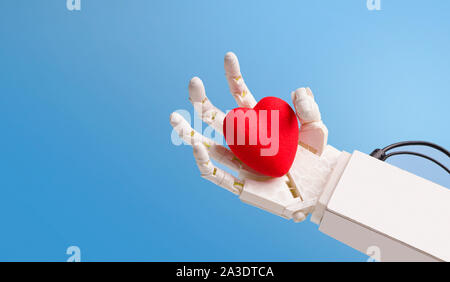 Red heart in robot hand, blue panorama background Stock Photo
