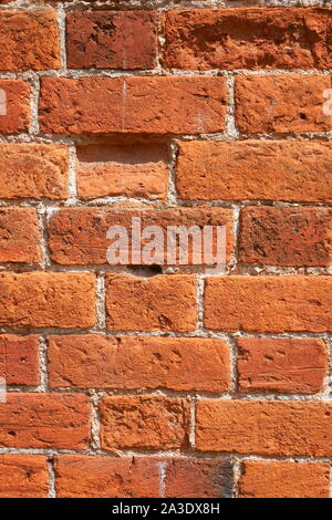 Old, weathered red brick wall, South Wales, United Kingdom Stock Photo