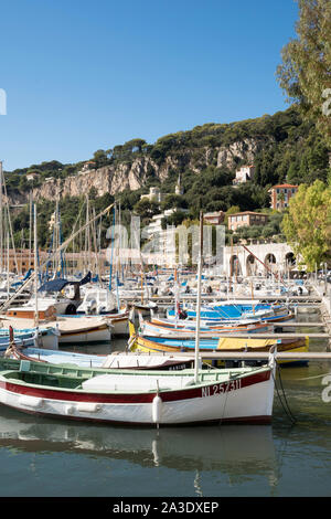 Traditional wooden fishing boats moored in Villefranche sur Mer harbour, France, Europe Stock Photo