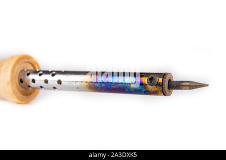 Small precision soldering iron for small electronic works. Accessories used in the electronics workshop. Light background. Stock Photo