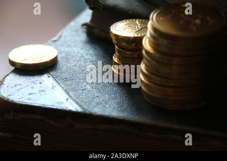 Money growth concept. Stacks of gold coins. Low key. Stock Photo