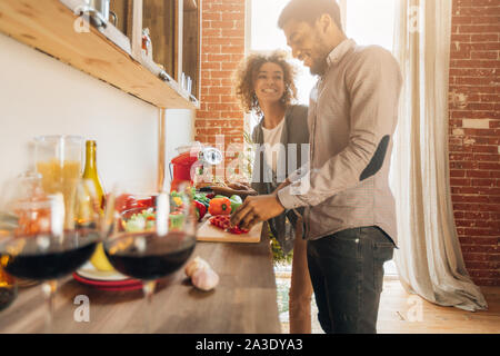 Happy couple cooking together. Stock Photo