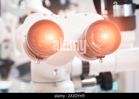 Microscope binocular eyepiece close-up Stock Photo