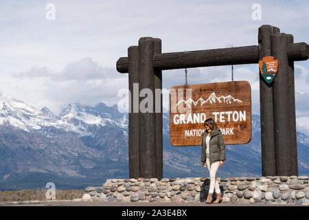 U.S First Lady Melania Trump poses at the Grand Teton National Park sign October 4, 2019 in Moose, Wyoming. Stock Photo