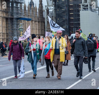 Westminster Bridge, London UK. 7th October 2019. Extinction rebellion climate change activists gather outside St Thomas' Hospital and Westminster bridge creating traffic disruption on major roads around Westminster.  This was the first day of protests which are planned accross London for the next fortnight to raise awareness of global climate change.  Celia McMahon/Alamy Live News. Credit: Celia McMahon/Alamy Live News