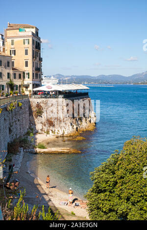 People on the beach in Corfu town Greece Stock Photo