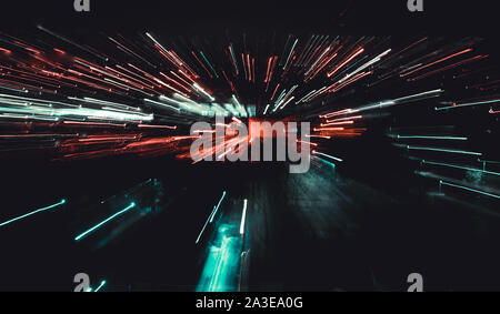 Street town unfocused motion abstract continuous lines perspectives red orange lights. Inside fast moving light sources , image used as a copy space b Stock Photo