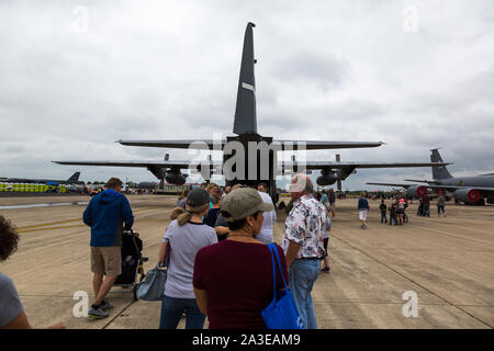 People line up to tour an iconic United States Air Force C-130 Hercules cargo plane at the Fort Wayne Airshow in Fort Wayne, Indiana, USA. Stock Photo