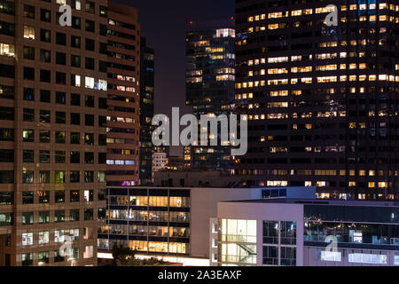 Dense urban cityscape of modern buildings at night in downtown Los Angeles, California Stock Photo