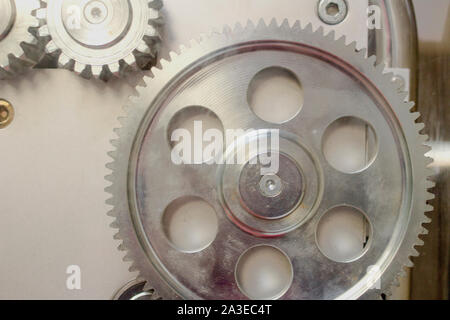 Parts of gear system , Close up of mechanical heavy steel metal wheel cog. Concept business idea. gears , cooperation and coworking . Teamwork, cooper Stock Photo
