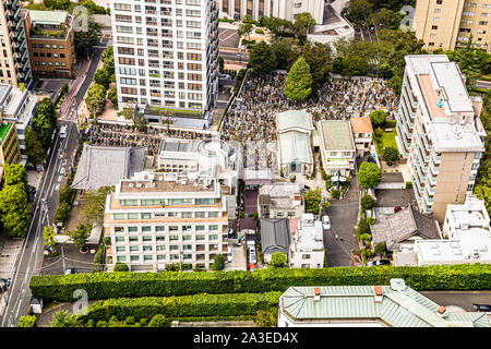 Cemetery amidst high-rise buildings in Tokyo, Japan Stock Photo