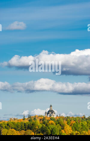 The dome of Church of the Visitation in the monastery of Pažaislis in Kaunas on a sunny autumn day. View from far away.With copy space for text. Stock Photo