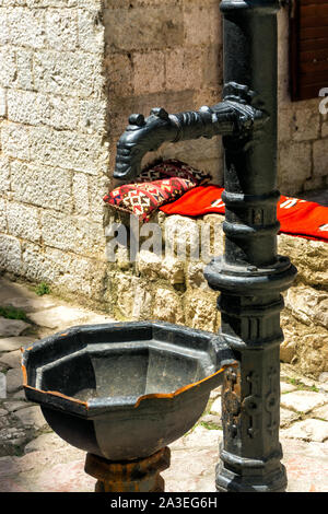 Old drinking water tap in the old town of Kotor, Montenegro Stock Photo