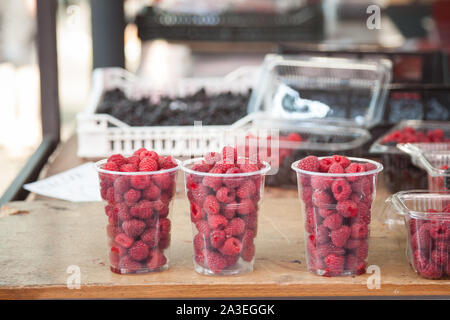 Raspberry, fresh and red, for sale on a market in Belgrade, Serbia piled on a stall. These are among the most traditional fruits of the Balkan peninsu Stock Photo
