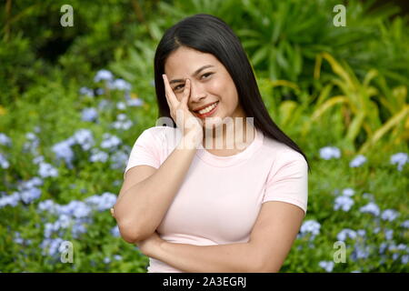 A Shy Youthful Filipina Woman Stock Photo