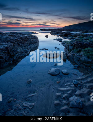Dusk over Church Bay on the coast of Anglesey, North Wales Stock Photo