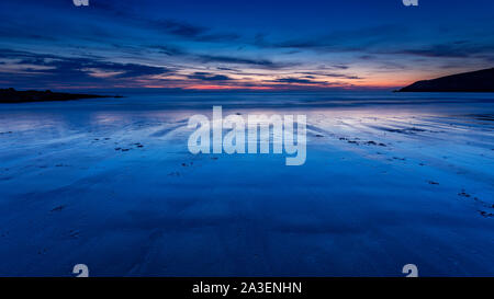 Dusk over Church Bay on the coast of Anglesey, North Wales Stock Photo