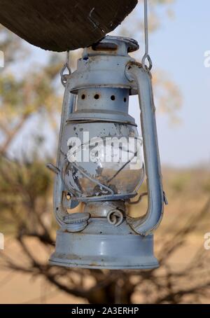 Vintage kerosene lamp hanging from a hut in Kruger National Park Stock Photo