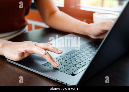 Woman hands office worker typing on the Enter keyboard Stock Photo