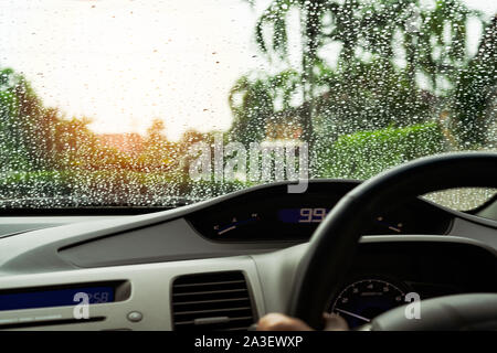 poor vision raindrops on car glass in rainy days Stock Photo