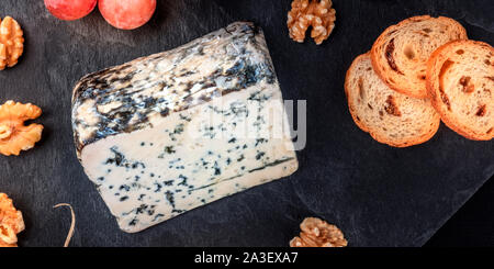 A panorama of Gorgonzola cheese, shot from above on a black background with copyspace Stock Photo