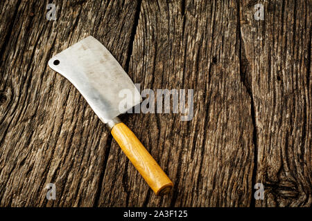 Vintage Meat cleaver on dark wooden background with copy space Stock Photo