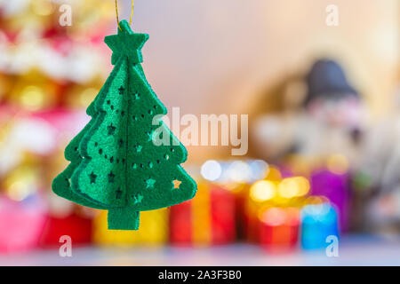 Christmas collection, gifts and decorative ornaments. Holiday Season background with decorations. Blue,green xmas trees. Gift boxes various colours. Stock Photo