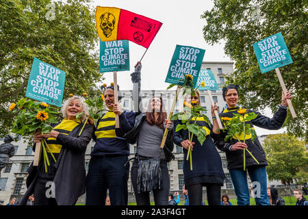 London, UK. 7th Oct 2019. Save the bees - Extinction Rebellion start the October action which will block roads in central London for up to two weeks. They are again highlighting the climate emergency, with time running out to save the planet from a climate disaster. This is part of the ongoing ER and other protests to demand action by the UK Government on the 'climate crisis'. The action is part of an international co-ordinated protest. Credit: Guy Bell/Alamy Live News Stock Photo