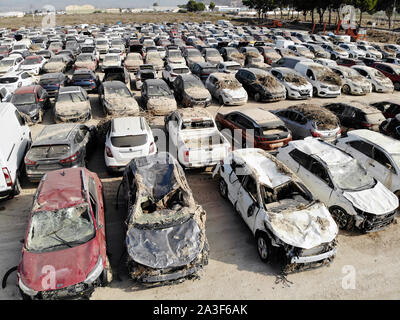 Aerial view new damaged cars due to flooding in dirt, spoiled can not be restored and used, gota fria September 2019, Orihuela, Torrevieja, Spain Stock Photo